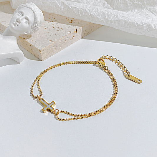 Women's cross bracelet - gold